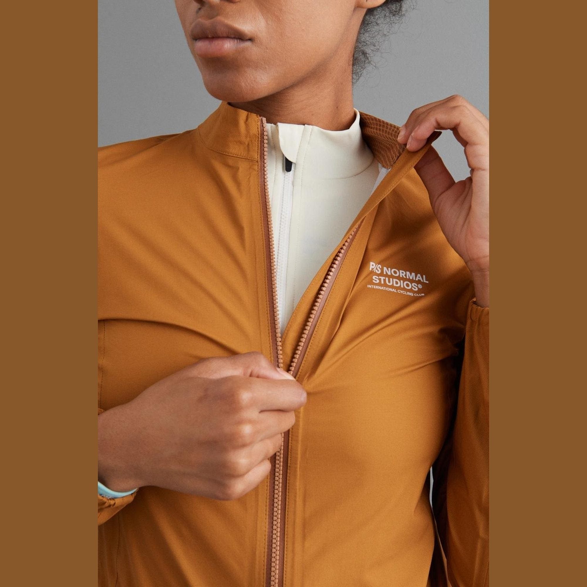 Pas Normal Studios - Women's Mechanism Pertex Rain Jacket - Burned Orange